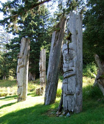 Photo of ancient Haida totems.